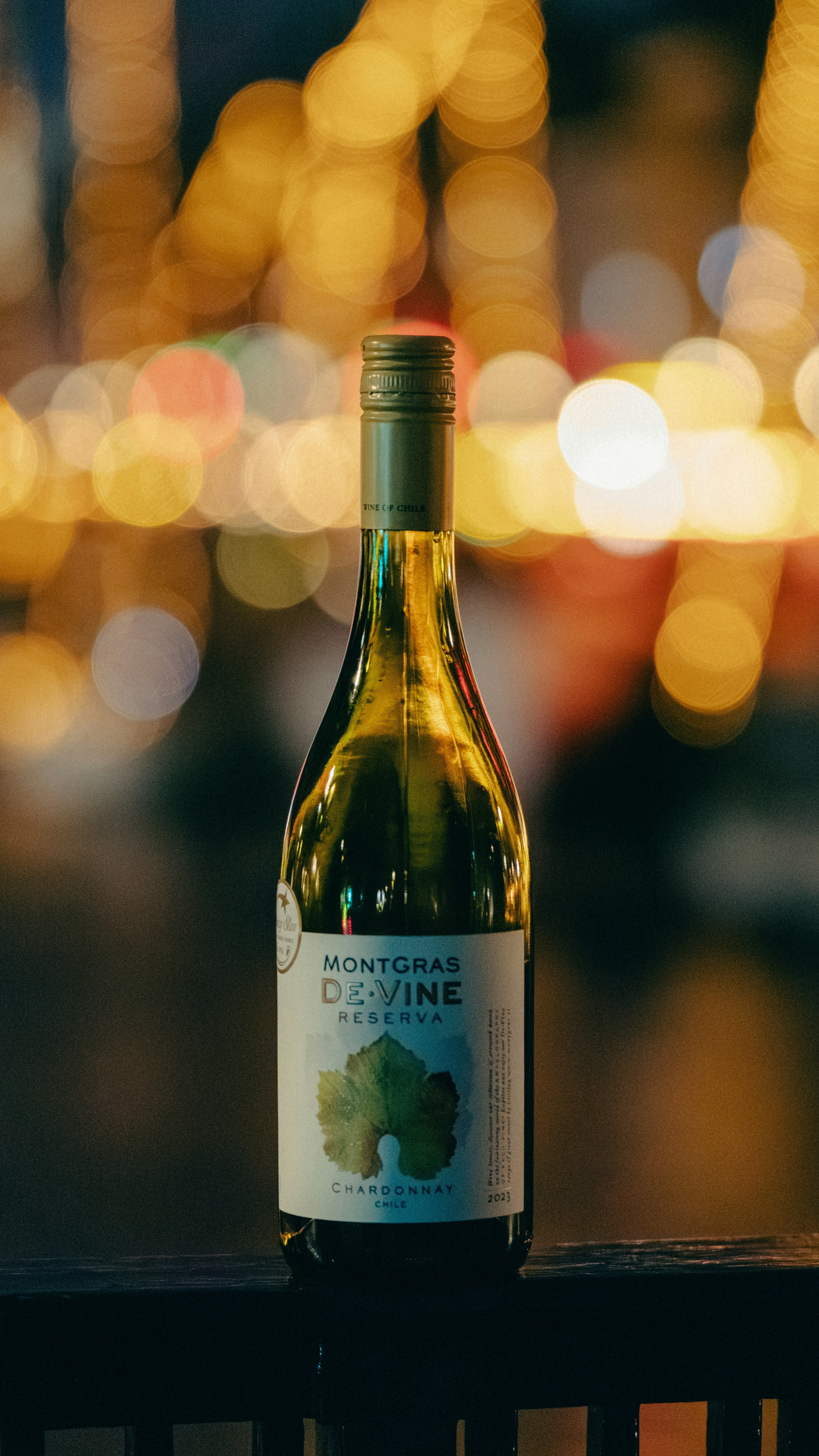 MontGras Chardonnay wine bottle with bokeh lighting